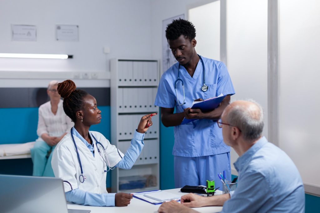 Professional medical team of black people doing consultation